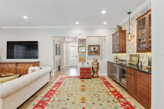 interior space with light wood-style flooring, recessed lighting, ornamental molding, decorative backsplash, and decorative light fixtures