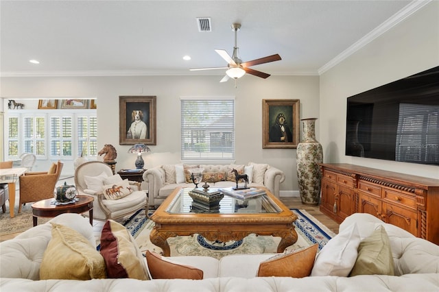 living room with ceiling fan, recessed lighting, visible vents, light wood-style floors, and crown molding