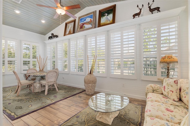 sunroom featuring lofted ceiling, wood ceiling, and ceiling fan