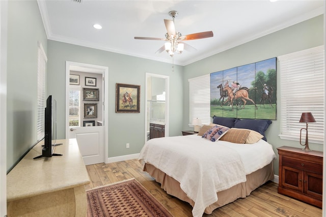 bedroom featuring ornamental molding, multiple windows, light wood-style flooring, and baseboards