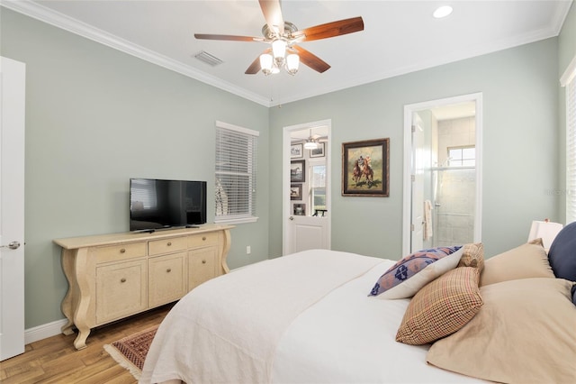 bedroom with ensuite bathroom, visible vents, baseboards, ornamental molding, and light wood finished floors