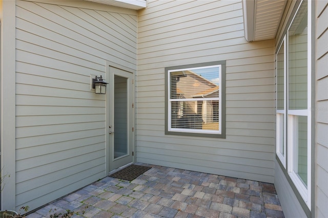 entrance to property with a patio area