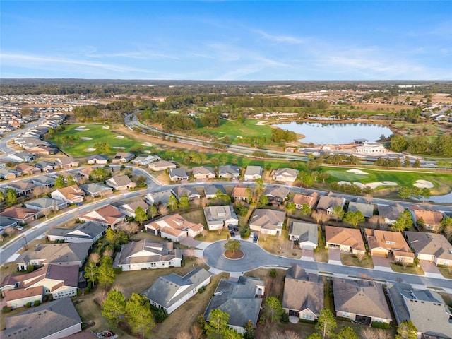 bird's eye view featuring golf course view, a water view, and a residential view