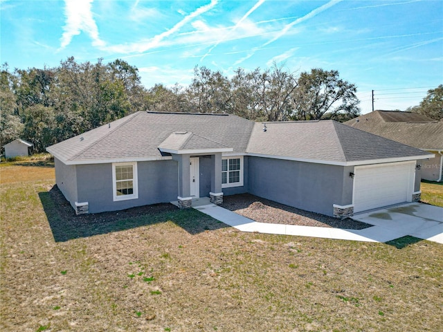 ranch-style house with a garage and a front yard