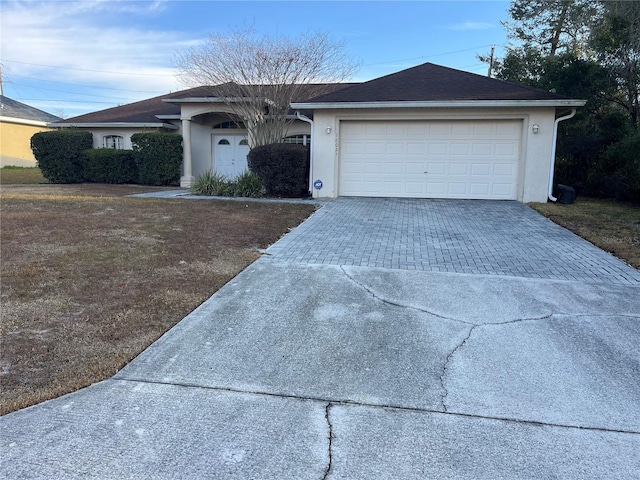 single story home featuring a garage