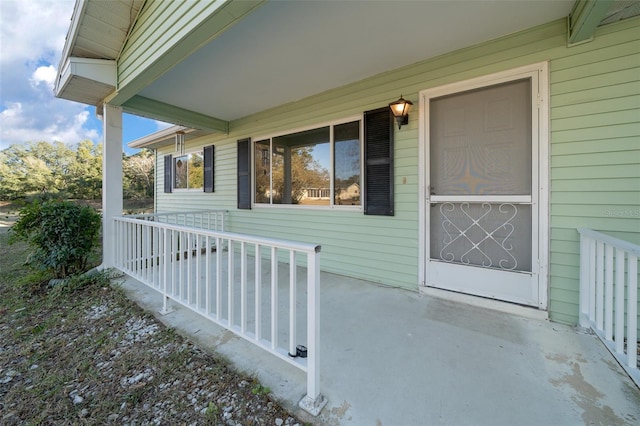 entrance to property featuring a porch