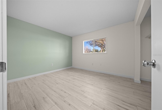 unfurnished room featuring light wood-type flooring