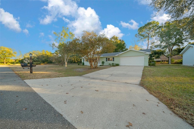 view of front of house with a garage and a front yard