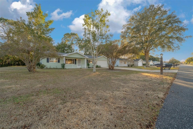 single story home with a porch and a front lawn