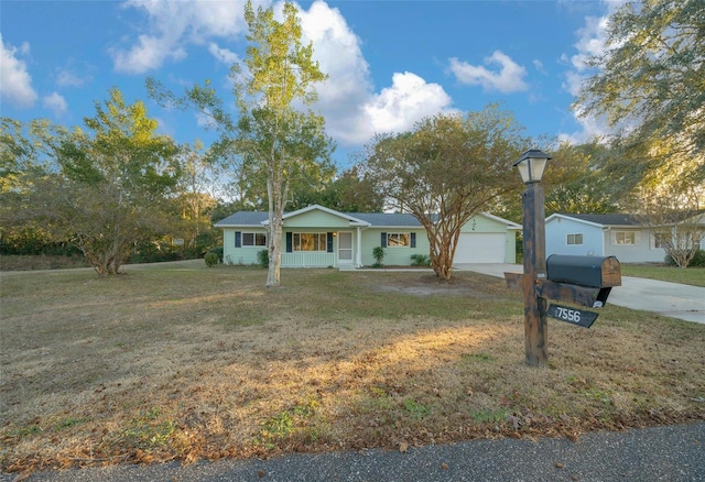 ranch-style house with a porch and a front yard