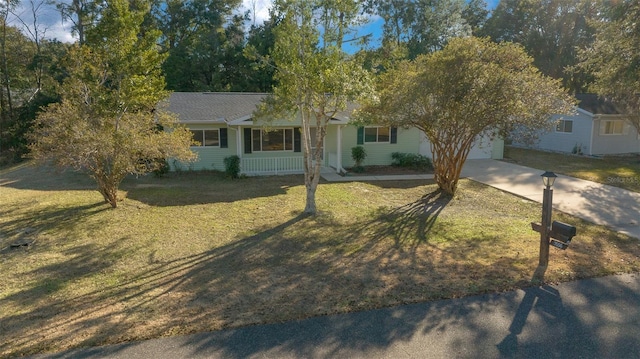 view of front of property with a garage and a front yard