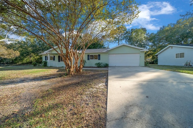 ranch-style home with a garage and a front lawn