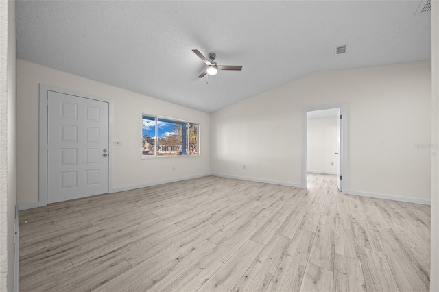 7556 SW 112th Ln, Ocala, FL 34476 - unfurnished living room with light wood finished floors, a ceiling fan, visible vents, baseboards, and vaulted ceiling