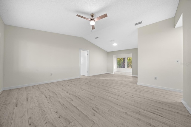 7556 SW 112th Ln, Ocala, FL 34476 - unfurnished living room featuring light wood finished floors, ceiling fan, lofted ceiling, and baseboards