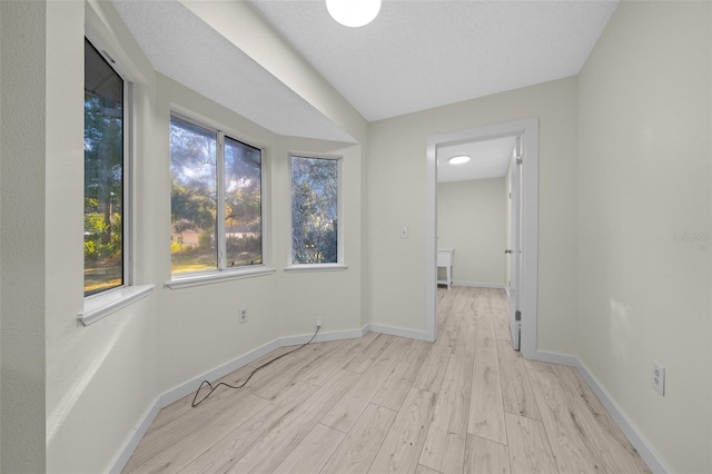 7556 SW 112th Ln, Ocala, FL 34476 - spare room with light wood-type flooring and baseboards