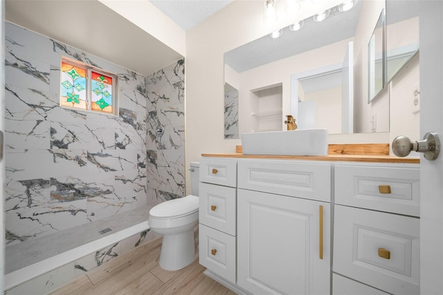 7556 SW 112th Ln, Ocala, FL 34476 - full bathroom with vanity, a marble finish shower, toilet, and wood finished floors