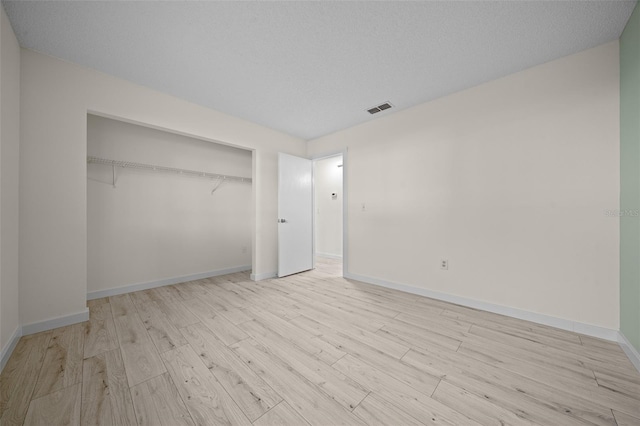 7556 SW 112th Ln, Ocala, FL 34476 - unfurnished bedroom featuring wood finished floors, baseboards, and a closet