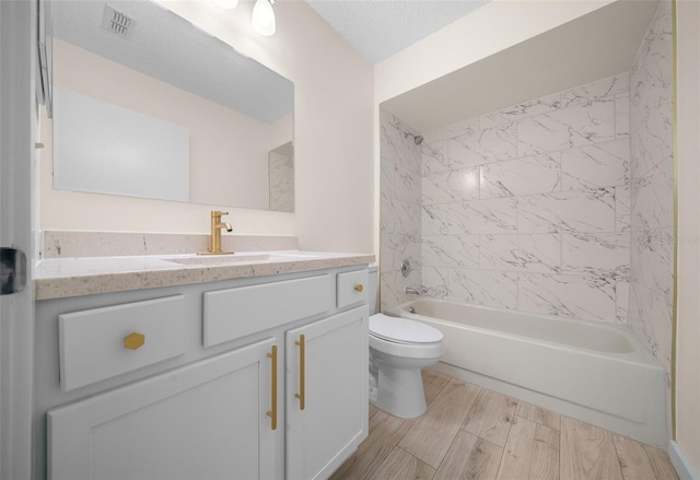 7556 SW 112th Ln, Ocala, FL 34476 - full bath with toilet, vanity, shower / bath combination, and wood finished floors