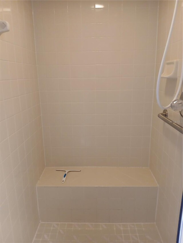 bathroom with tiled shower