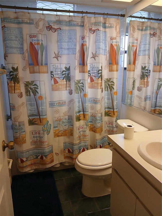 bathroom with toilet, tile patterned floors, a shower with curtain, and vanity