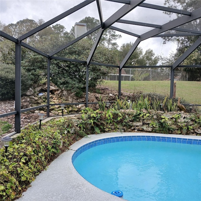 outdoor pool featuring a lanai