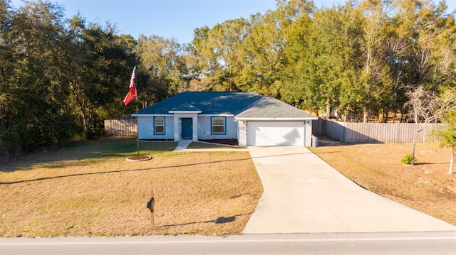 single story home with a garage and a front lawn