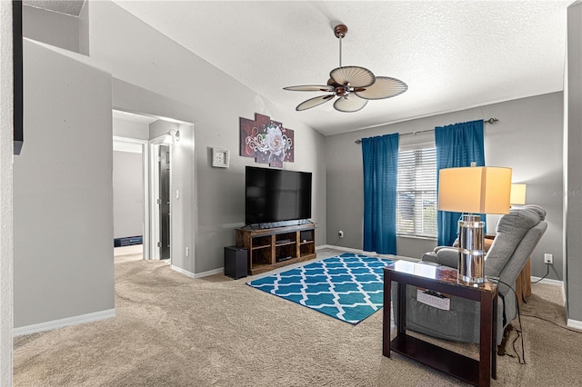 carpeted living room with lofted ceiling, a textured ceiling, and ceiling fan