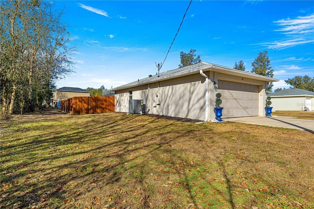 view of side of property with cooling unit and a lawn