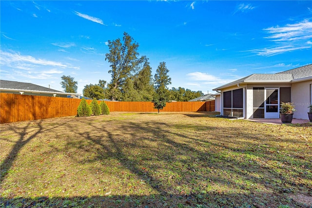 view of yard featuring a sunroom