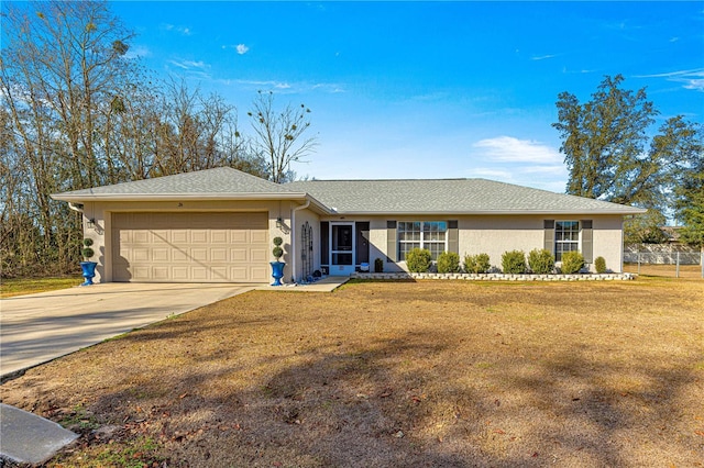 ranch-style home featuring a garage and a front yard