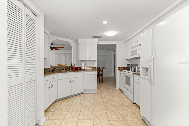 kitchen featuring sink, white appliances, light tile patterned floors, ceiling fan, and white cabinetry