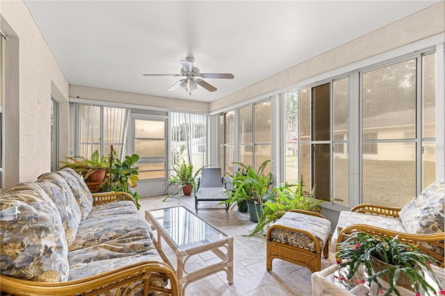 sunroom / solarium featuring ceiling fan