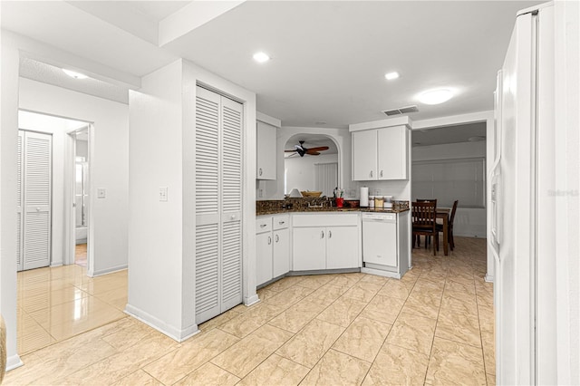 kitchen featuring dishwasher, sink, white cabinets, and ceiling fan