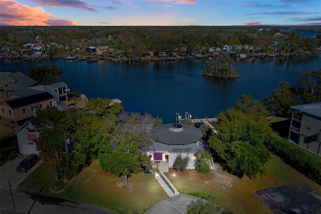 aerial view at dusk with a water view