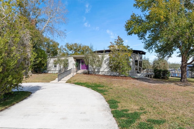 view of front of home with a front lawn