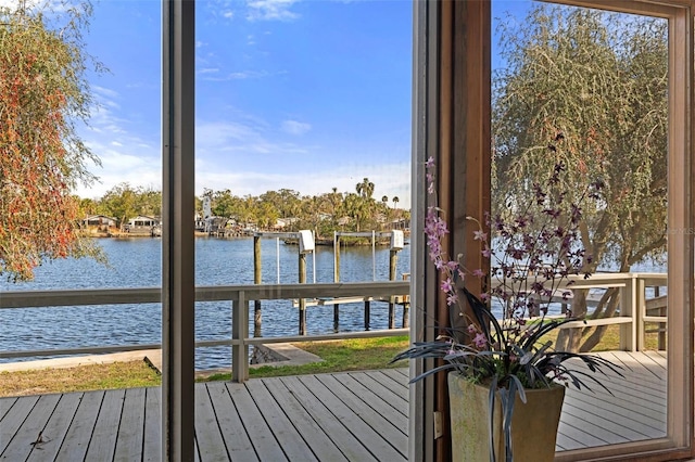 exterior space featuring a water view and a dock