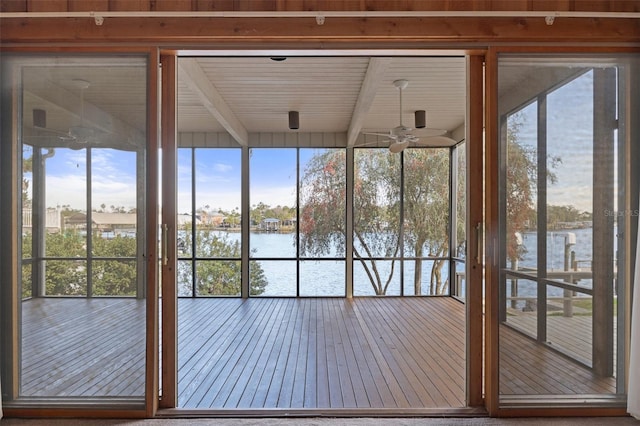 entryway featuring a water view, floor to ceiling windows, and hardwood / wood-style flooring