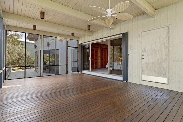 interior space with ceiling fan