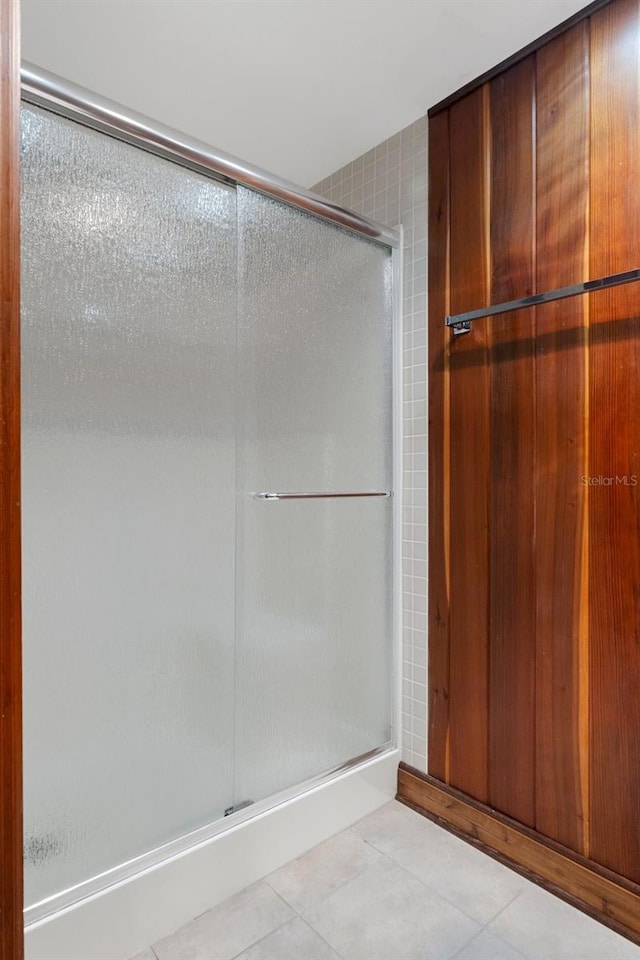 bathroom featuring tile patterned floors and an enclosed shower