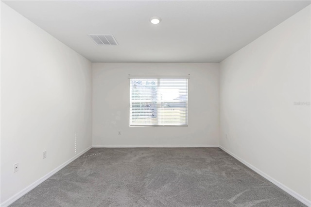 unfurnished room featuring carpet floors