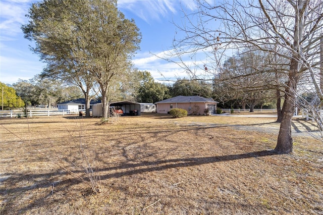 view of yard with a carport