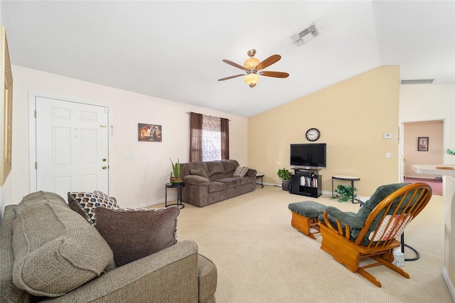 carpeted living room with vaulted ceiling and ceiling fan