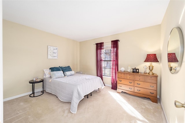 bedroom featuring light carpet