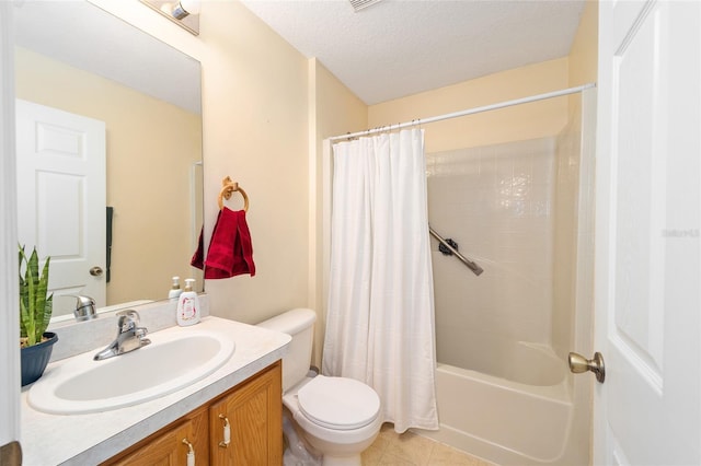 full bathroom with vanity, a textured ceiling, tile patterned floors, toilet, and shower / bath combo with shower curtain