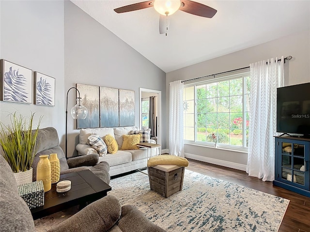 living room featuring dark wood-type flooring, ceiling fan, and high vaulted ceiling