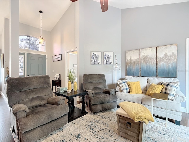 living room featuring hardwood / wood-style flooring and high vaulted ceiling