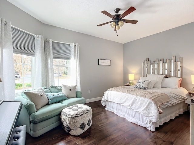 bedroom featuring ceiling fan and dark hardwood / wood-style flooring