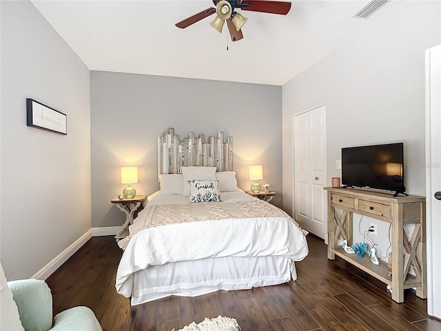 bedroom featuring ceiling fan and dark hardwood / wood-style flooring