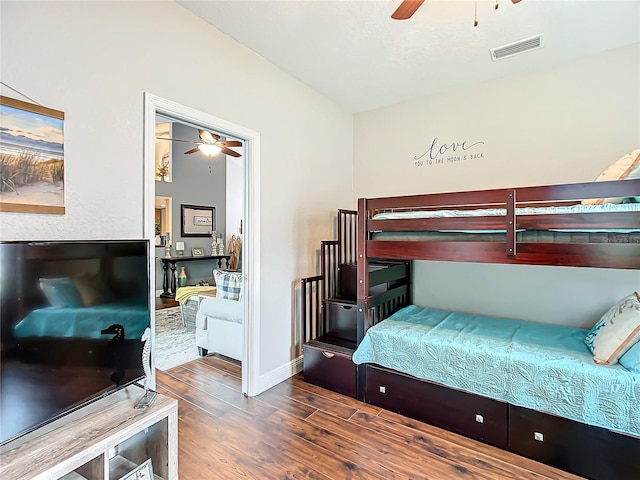 bedroom featuring ceiling fan and dark hardwood / wood-style floors