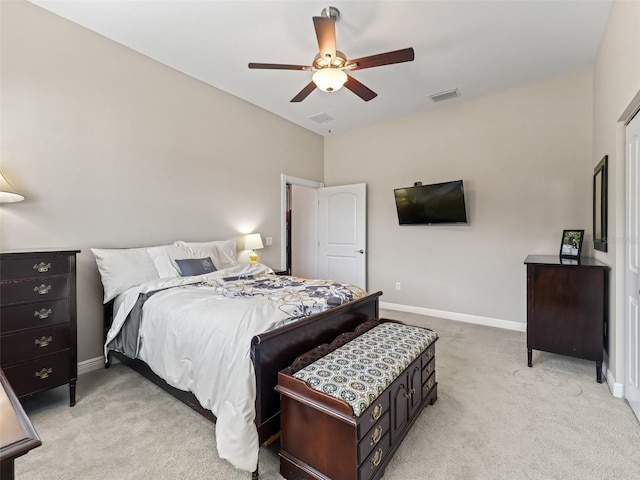 bedroom featuring light colored carpet and ceiling fan